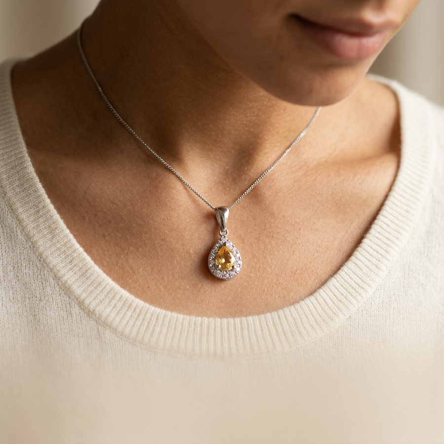 _Photorealistic_editorial_jewellery_photograph._A_close-up_of_a_woman_s_collarbone_and_neckline__wearing_resting_just_below_the_collarbone._She_is_wearing_a_so
