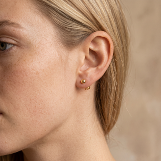 Model wearing 9K Yellow Gold 6mm Polished Ball Stud Earrings - Sonny's Jewellers
