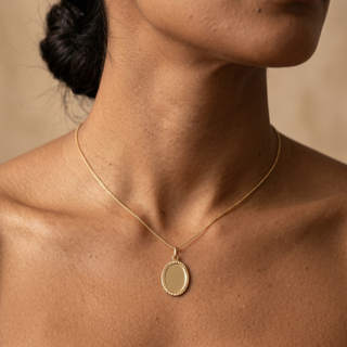Model wearing 9K Yellow Gold Oval Patterned-Border Pendant - Sonny's Jewellers