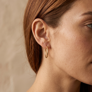 Model wearing 9K Yellow Gold 15mm Sleeper Hoop Earrings - Sonny's Jewellers