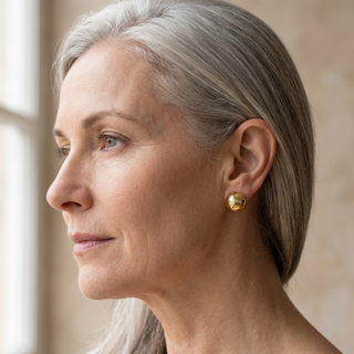 Model wearing 9K Yellow Gold 8mm Half-Ball Polished Stud Earrings - Sonny's Jewellers