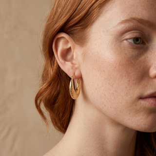 Model wearing 9K Yellow Gold Patterned Creole Hoop Earrings - Sonny's Jewellers