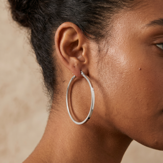 Model wearing 9K White Gold Rectangular-Tube 35mm Hoop Creole Earrings - Sonny's Jewellers