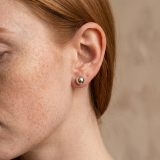 Model wearing 9K White Gold 5mm Polished Ball Stud Earrings - Sonny's Jewellers
