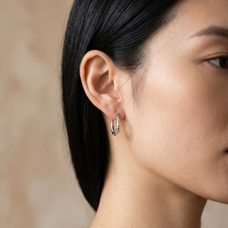 Model wearing 9K White Gold Mini Groove Creole Hoop Earrings - Sonny's Jewellers