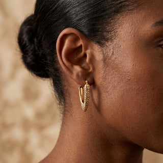 Model wearing 9K Yellow Gold Elongated V-Shape Drop Hoop Earrings - Sonny's Jewellers