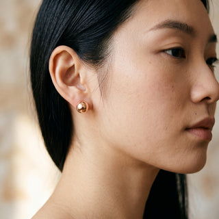 Model wearing 9K Rose Gold 8mm Polished Ball Stud Earrings - Sonny's Jewellers