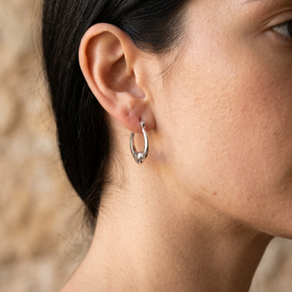 Model wearing 9K White Gold Heart Creole Hoop Earrings - Sonny's Jewellers