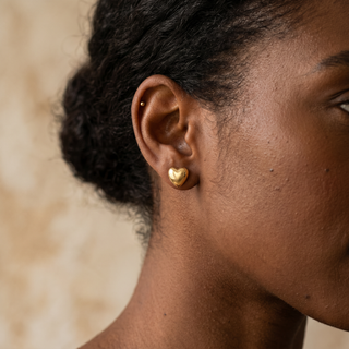 Model wearing 9K Yellow Gold 3D Polished Heart Stud Earrings - Sonny's Jewellers