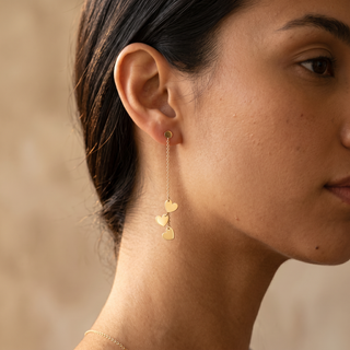Model wearing 9K Yellow Gold 3-Heart Drop Earrings - Sonny's Jewellers