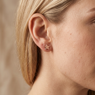 Model wearing 9K Rose Gold Polished Star Stud Earrings - Sonny's Jewellers
