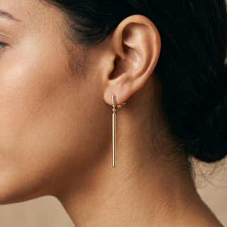 Model wearing 9K Yellow Gold Num-Chucka Drop Earrings - Sonny's Jewellers
