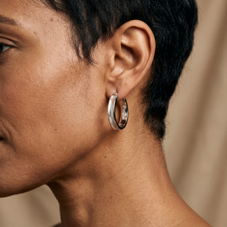 Model wearing 9K White Gold Satin Hoop Earrings - Sonny's Jewellers