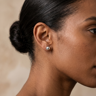 Model wearing 9K White Gold 8mm Ball Stud Earrings - Sonny's Jewellers