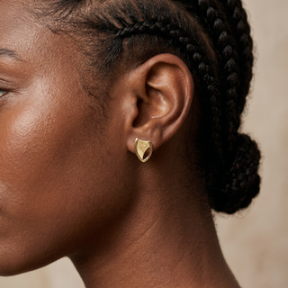 Model wearing 9K Yellow Gold Textured Shield Stud Earrings - Sonny's Jewellers