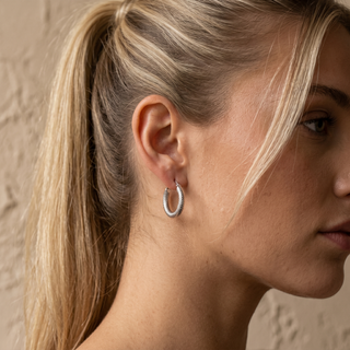 Model wearing 9K White Gold 15mm Dimple Facet Hoop Earrings - Sonny's Jewellers