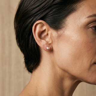 Model wearing 9K Rose Gold 5mm Satin Ball Stud Earrings - Sonny's Jewellers