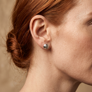 Model wearing 9K White Gold 7mm Ripple Ball Stud Earrings - Sonny's Jewellers