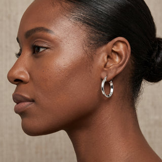 Model wearing 9K White Gold Hoop Earrings - Sonny's Jewellers