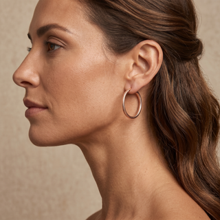 Model wearing 9K Rose Gold Dimple Facet Hoop Earrings - Sonny's Jewellers