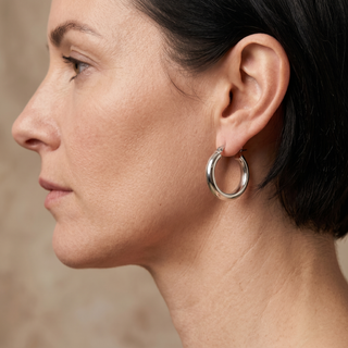 Model wearing 9K White Gold 19mm Hoop Creole Earrings - Sonny's Jewellers