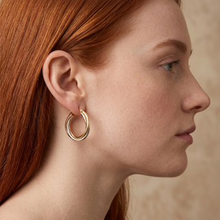 Model wearing 9K 3-Colour Gold 28mm Twist Creole Hoop Earrings - Sonny's Jewellers