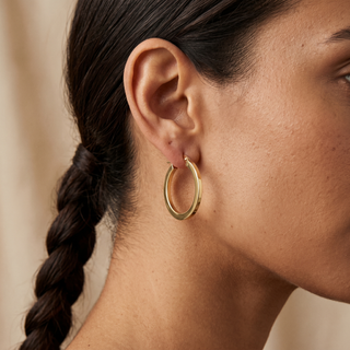 Model wearing 9K Yellow Gold Flat Creole Hoop Earrings - Sonny's Jewellers
