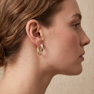 Model wearing 9K 2-Colour Gold V-Shaped Huggie Hoop Earrings - Sonny's Jewellers