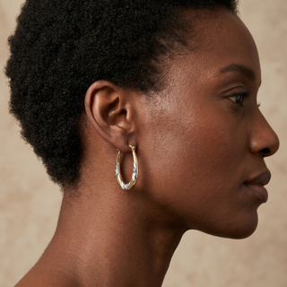 Model wearing 9K Yellow & White Gold Creole Hoop Earrings - Sonny's Jewellers