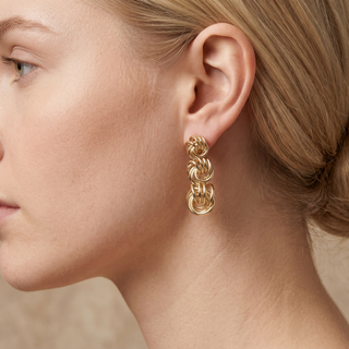 Model wearing 9K Yellow Gold Graduated-Knot Drop Earring - Sonny's Jewellers