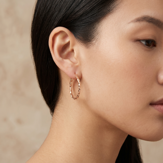 Model wearing 9K Rose Gold Twisted Creole Hooped Earrings - Sonny's Jewellers