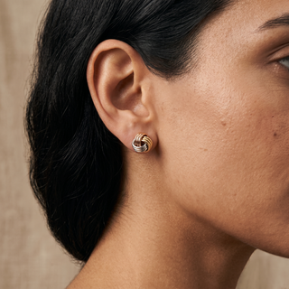 Model wearing 9K Tri-Colour Knot Stud Earrings - Sonny's Jewellers