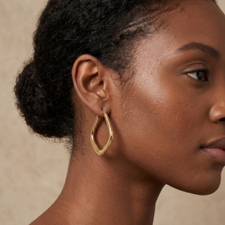 Model wearing 9K Yellow Gold Curved-Square-Edge Creole Earrings - Sonny's Jewellers