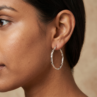 Model wearing 9K White Gold 30mm Flat Wrap Hoop Earrings - Sonny's Jewellers