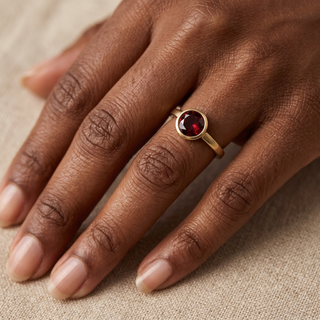 Model wearing 9K Yellow Gold Round Garnet Ring - Sonny's Jewellers