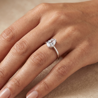 Model wearing 9K White Gold Pear Cut CZ Ring - Sonny's Jewellers