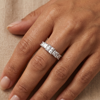 Model wearing 9K White Gold Princess Cut CZ Graduated 5-Stone Ring - Sonny's Jewellers