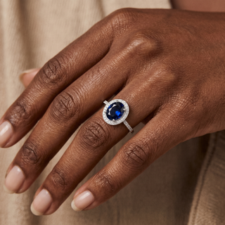 Model wearing 9K White Gold Blue & White Oval CZ Cluster Ring - Sonny's Jewellers