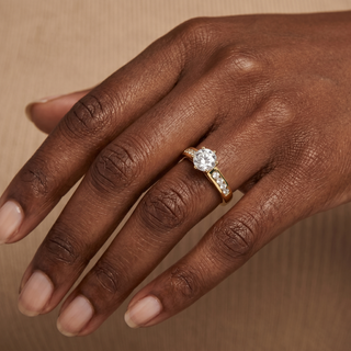 Model wearing 9K Yellow Gold Round Solitaire CZ With CZ Shoulder Ring - Sonny's Jewellers