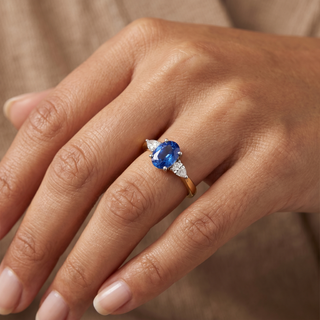Model wearing 18K Yellow Gold Sapphire & Diamond Trilogy Ring - Sonny's Jewellers