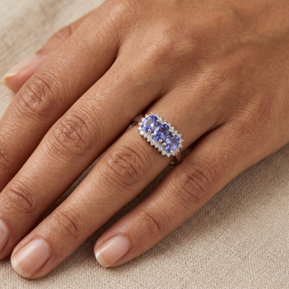 Model wearing 9K White Gold Oval Tanzanite Trilogy Cluster Ring - Sonny's Jewellers