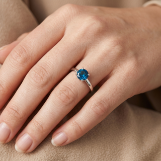 Model wearing 9K White Gold Round Blue Topaz Solitaire Ring - Sonny's Jewellers