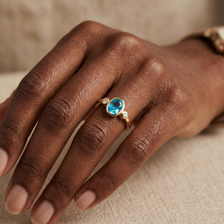 Model wearing 9K Yellow Gold Oval Blue Topaz & Diamond Ring - Sonny's Jewellers