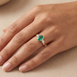 Model wearing 9K Yellow Gold Oval Emerald & Diamond Ring - Sonny's Jewellers
