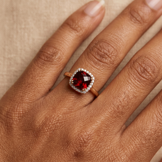 Model wearing 9K Yellow Gold Garnet and Diamond Halo Ring - Sonny's Jewellers