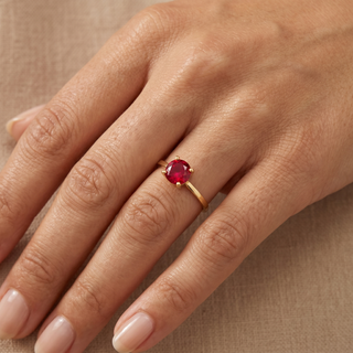 Model wearing 9ct Yellow Gold Solitaire Red CZ Ring - Sonny's Jewellers