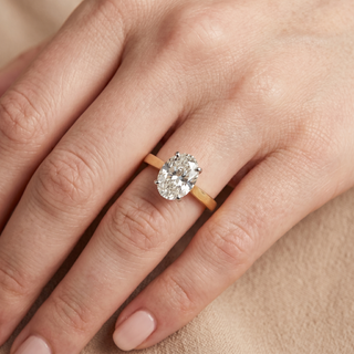 Model wearing 18K Yellow & White Gold Oval Solitaire Ring - Sonny's Jewellers
