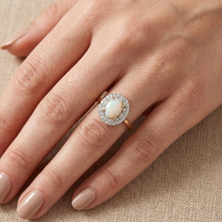 Model wearing 9K Yellow Gold Oval Opal & Diamond Halo Ring - Sonny's Jewellers