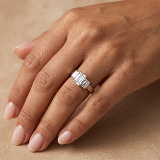 Model wearing Platinum 3 Stone Emerald Diamond Ring - Sonny's Jewellers