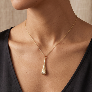 Model wearing 9K Yellow Gold Diamond Cut Teardrop Necklace - Sonny's Jewellers